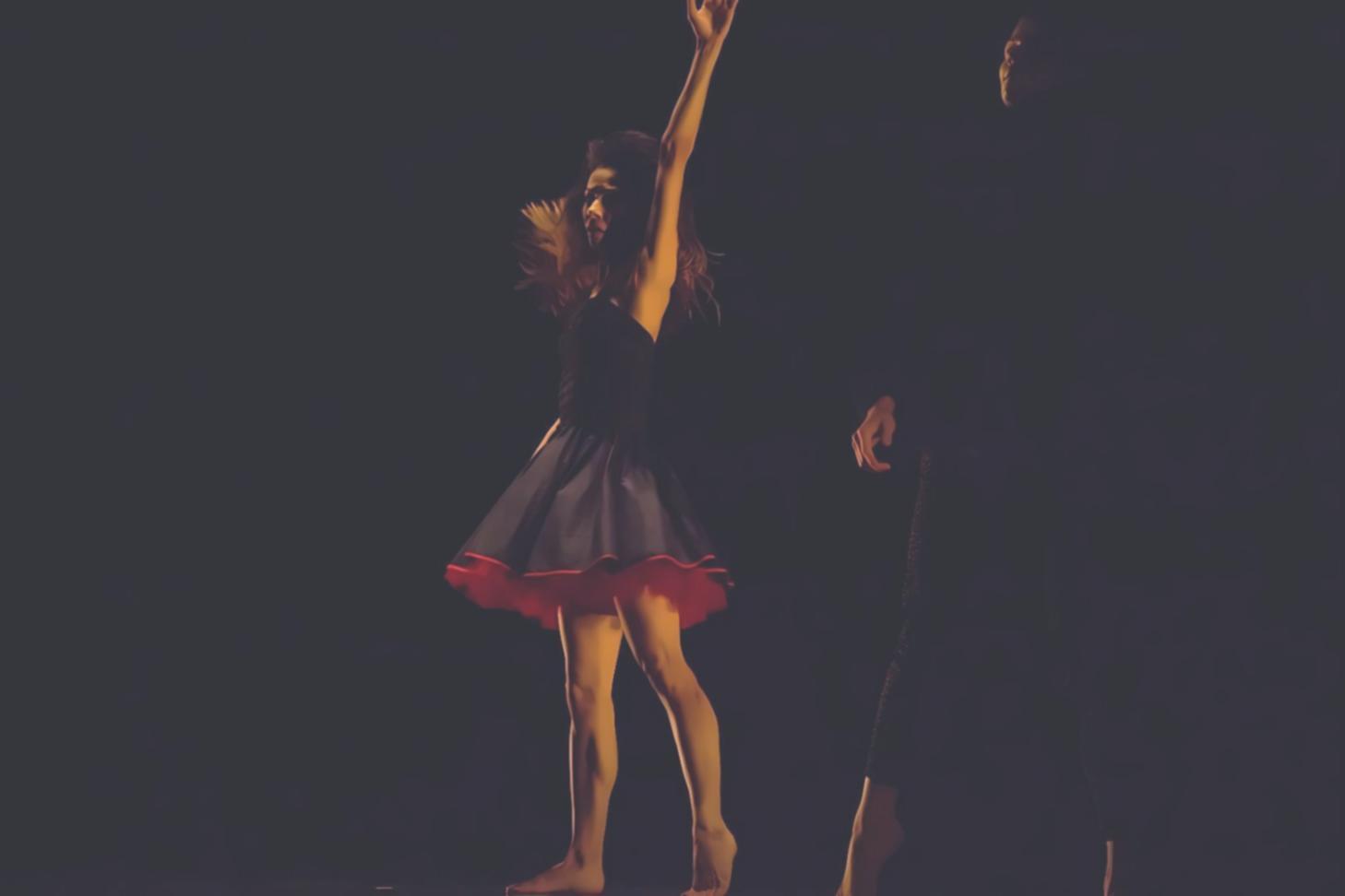 Advanced dancers performing elegant ballroom routine during practice session